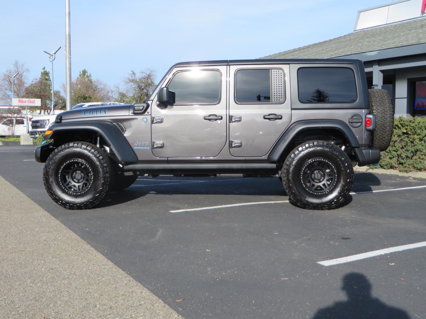 2023 CHARCOAL /black Jeep Wrangler Unlimited Willys 4XE (1C4JJXN68PW) with an 2.0L L4 DOHC 16V HYBRID engine, 8A transmission, located at 2630 Grass Valley Highway, Auburn, CA, 95603, (530) 508-5100, 38.937893, -121.095482 - 3" Zone Offroad lift kit, Fox Adventure series shocks, 17" Method Race wheels, 37" BFG KO2 tires, and a Teraflex spare tire carrier. - Photo#7